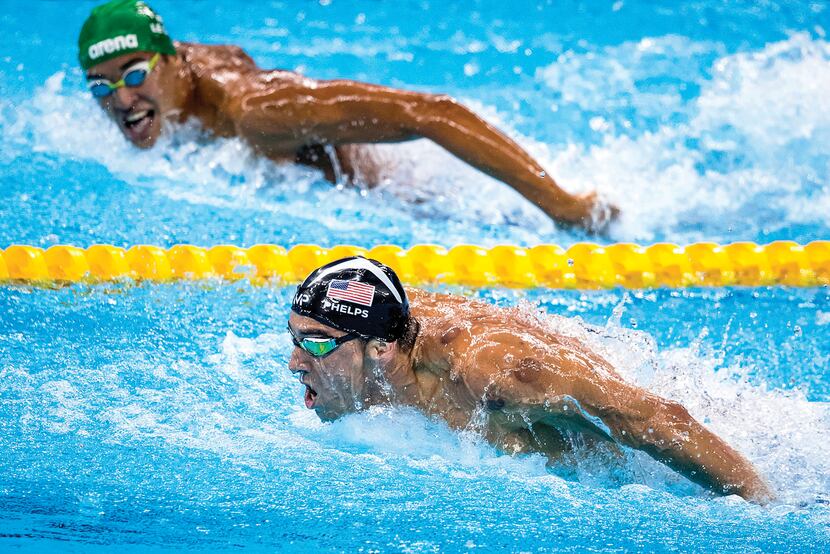 Michael Phelps led Chad Guy Bertrand Le Clos of South Africa as the American closed in on...