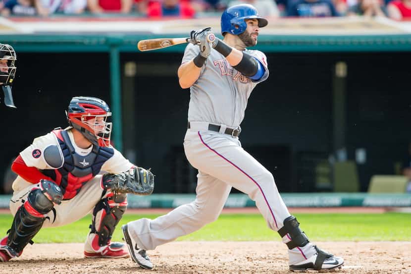 CLEVELAND, OH - MAY 25: Mitch Moreland #18 of the Texas Rangers hits a two RBI single during...