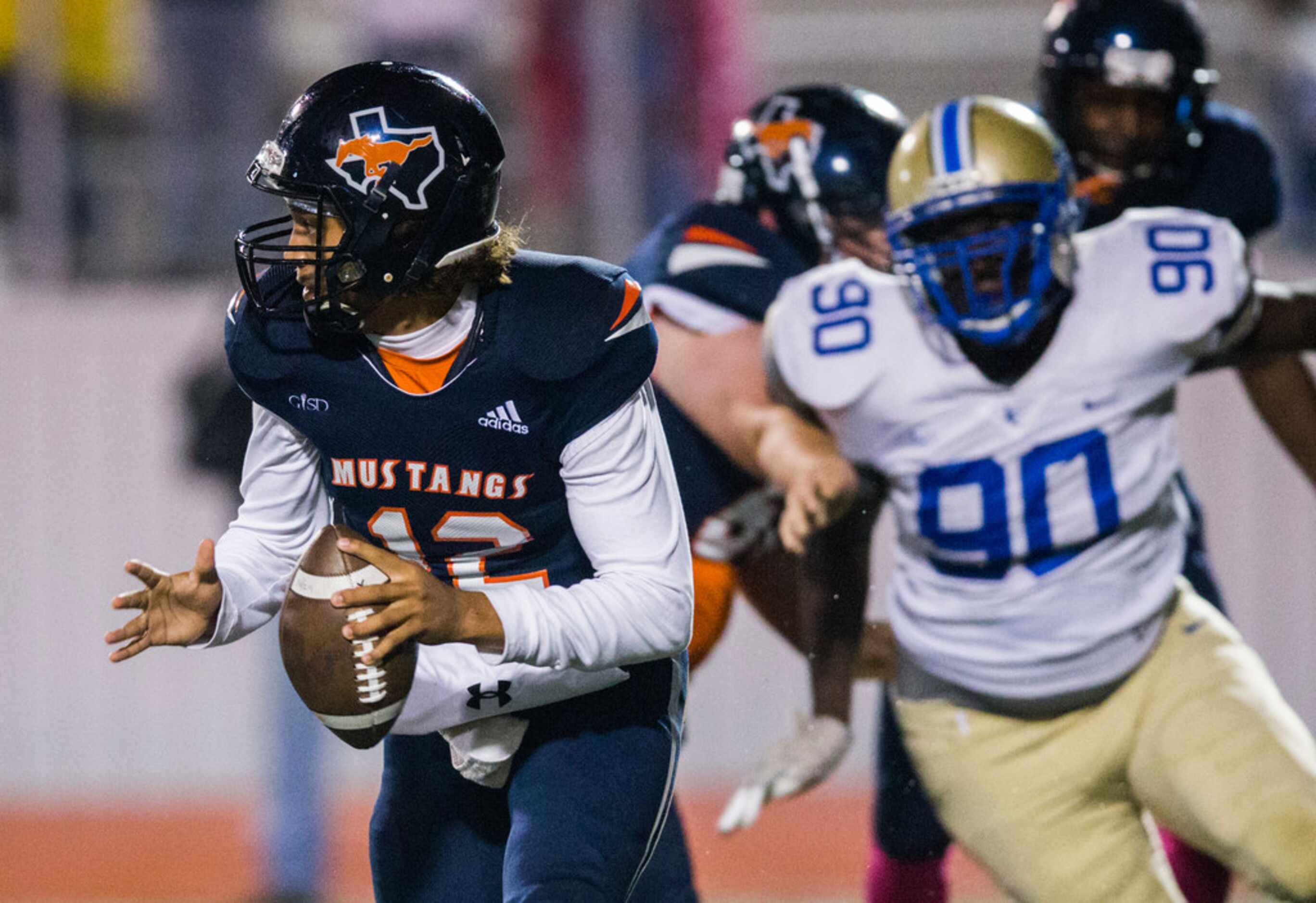Sachse quarterback Xavier Forman (12) looks for a receiver during the first quarter of a...