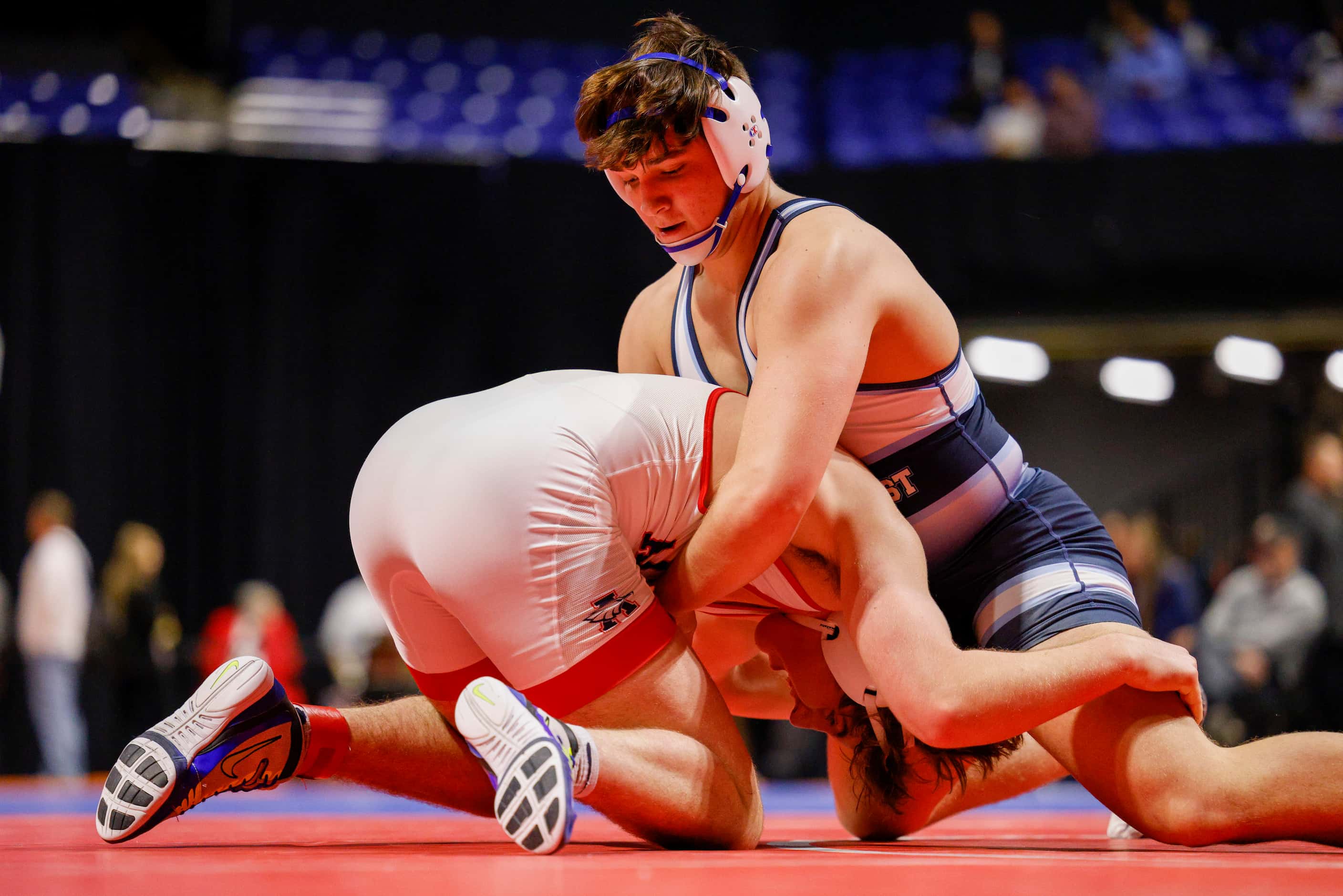 Farid Mobarak of Plano West wrestles Tristan Winters of Allen during the championship match...