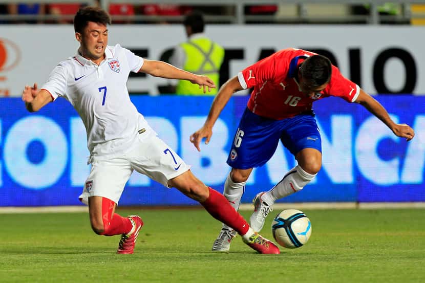 Lee Nguyen (left) fights for the ball with Chile's Gonzalo Fierro during a friendly in...