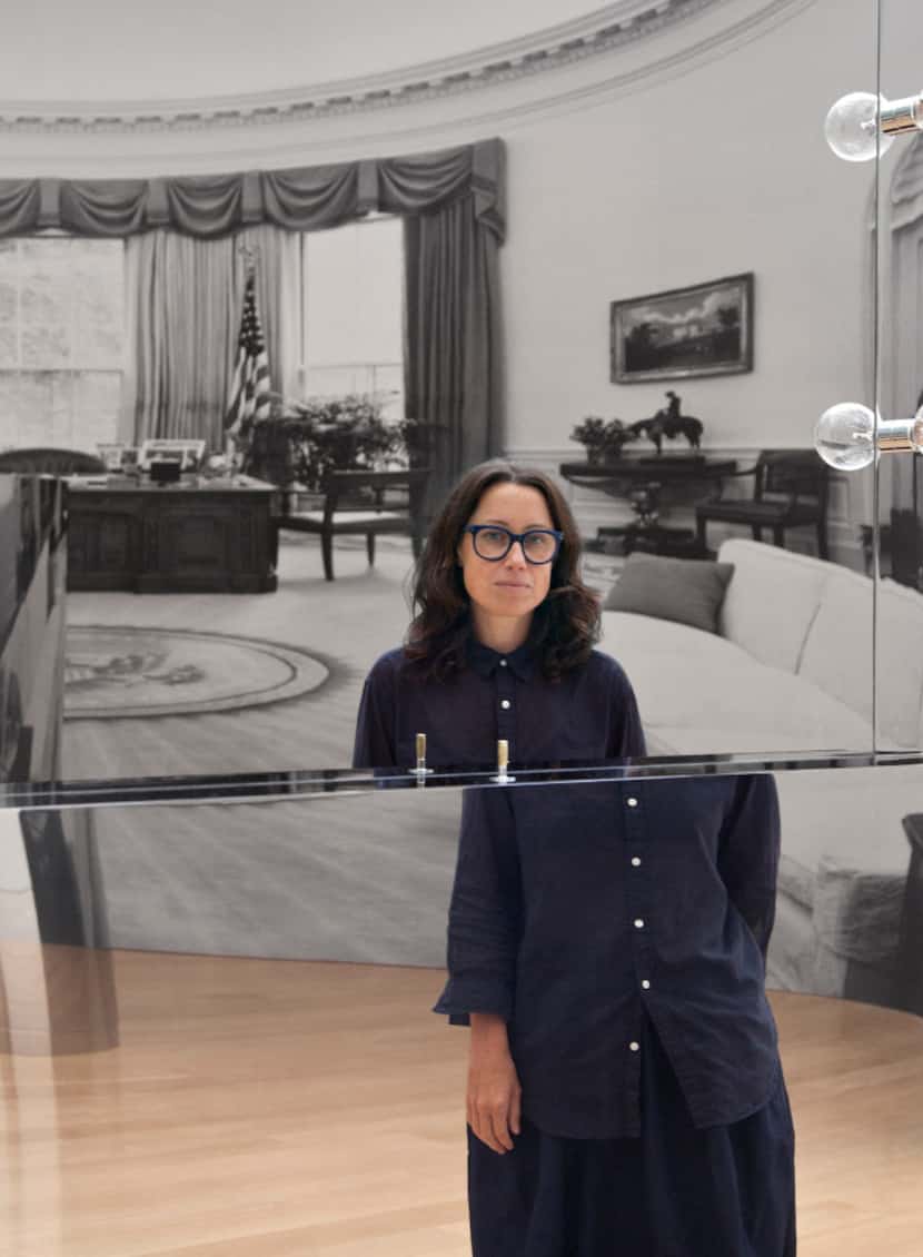 Artist Kathryn Andrews is photographed at the "Run for President" exhibition in a reflection...
