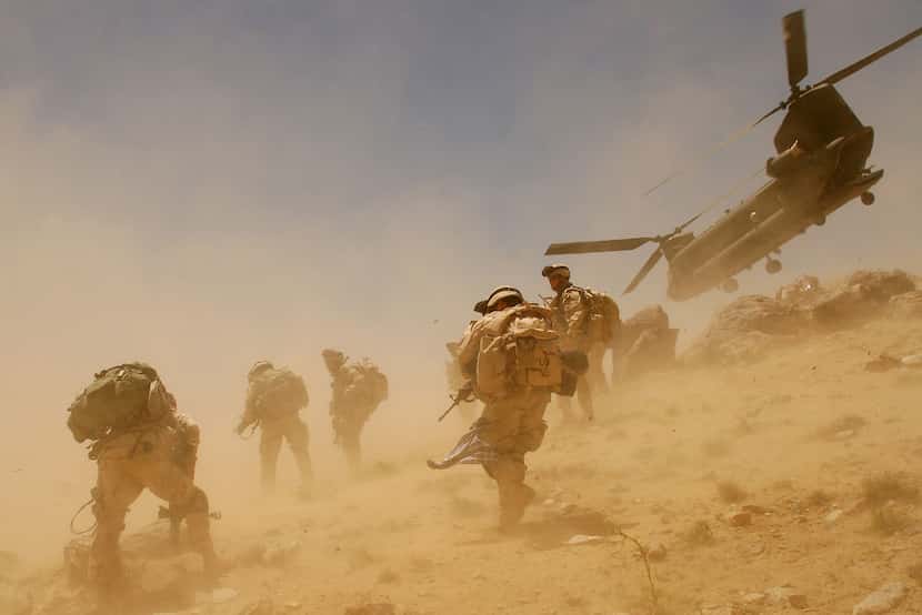 A CH-47 Chinook helicopter takes off after dropping soldiers in Zabul province in Afghanistan