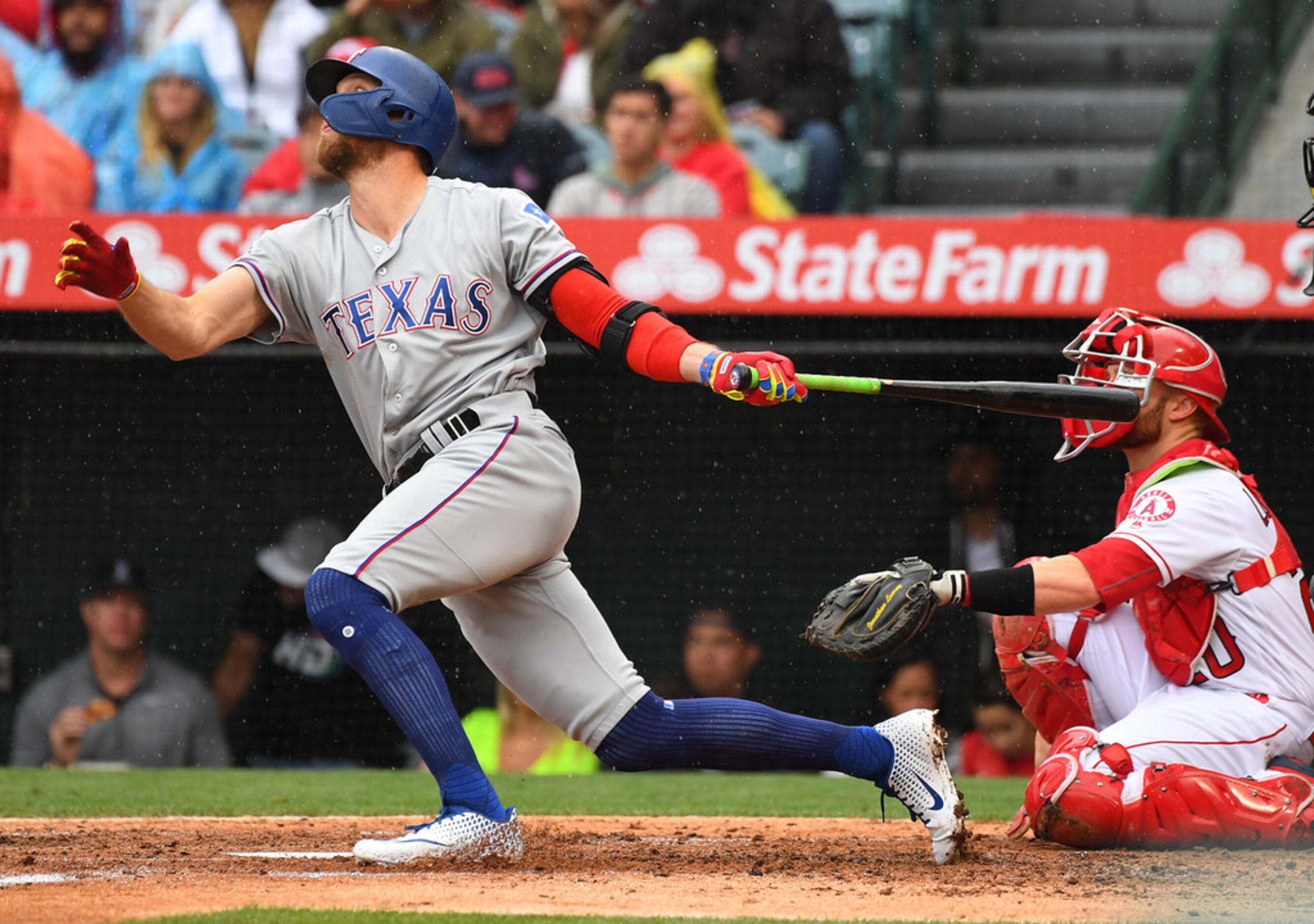 ANAHEIM, CA - MAY 26: Hunter Pence #24 of the Texas Rangers hits a solo home run in the...