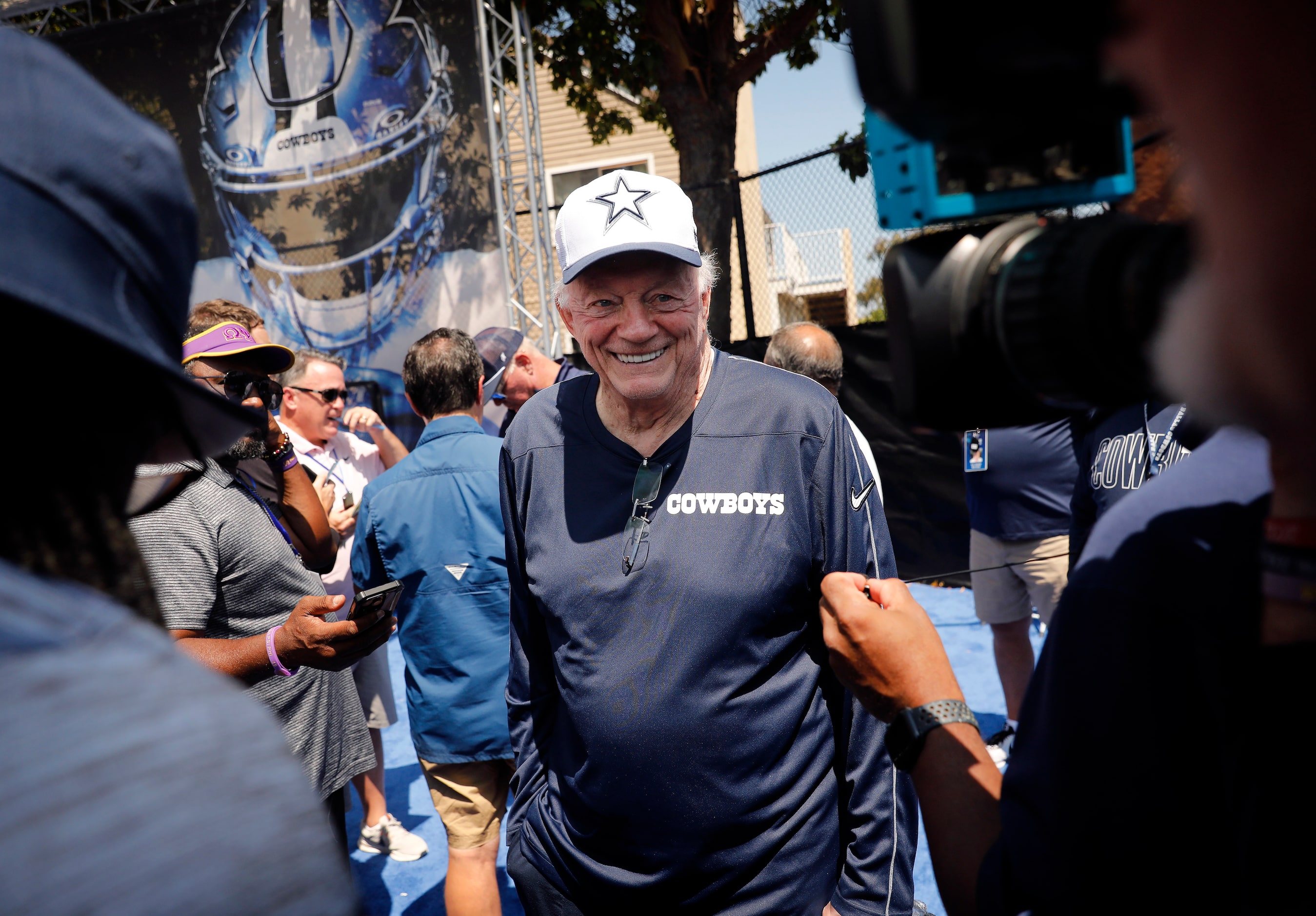 Dallas Cowboys owner Jerry Jones visits with members of the media following his opening...