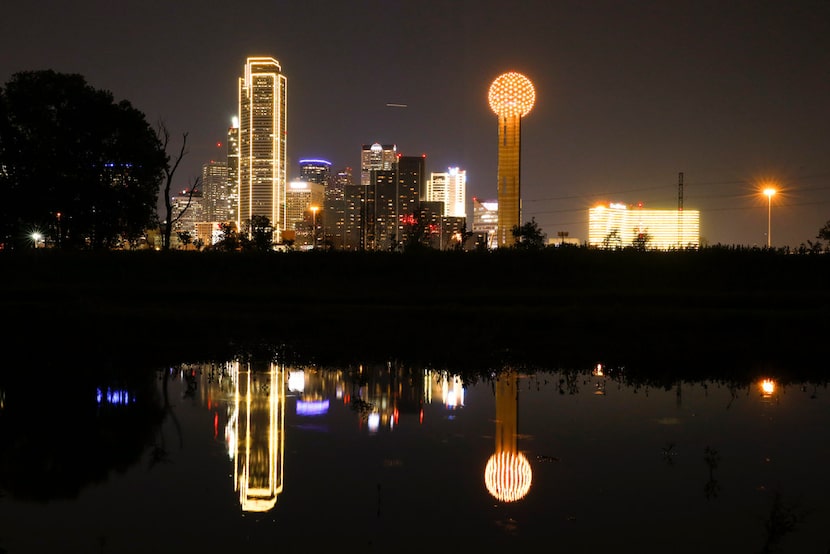 Downtown Dallas buildings are lit in gold in honor of the #BeGolden campaign in Dallas on...