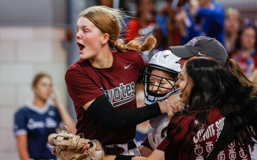 Frisco Heritage senior pitcher Jensin Hall (51, left) and senior catcher Kailey Sweezey (23,...