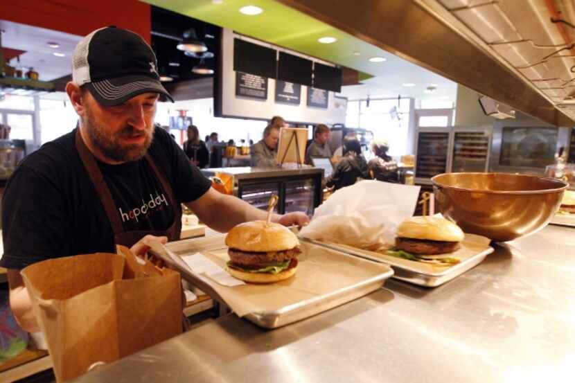 Bryan Davis, a kitchen lead, works the counters at Hopdoddy Burger Bar.