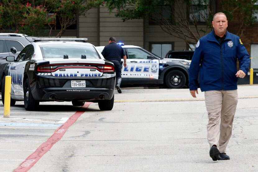 Dallas police work the scene of an officer-involved shooting in the 9600 block of Golf Lakes...