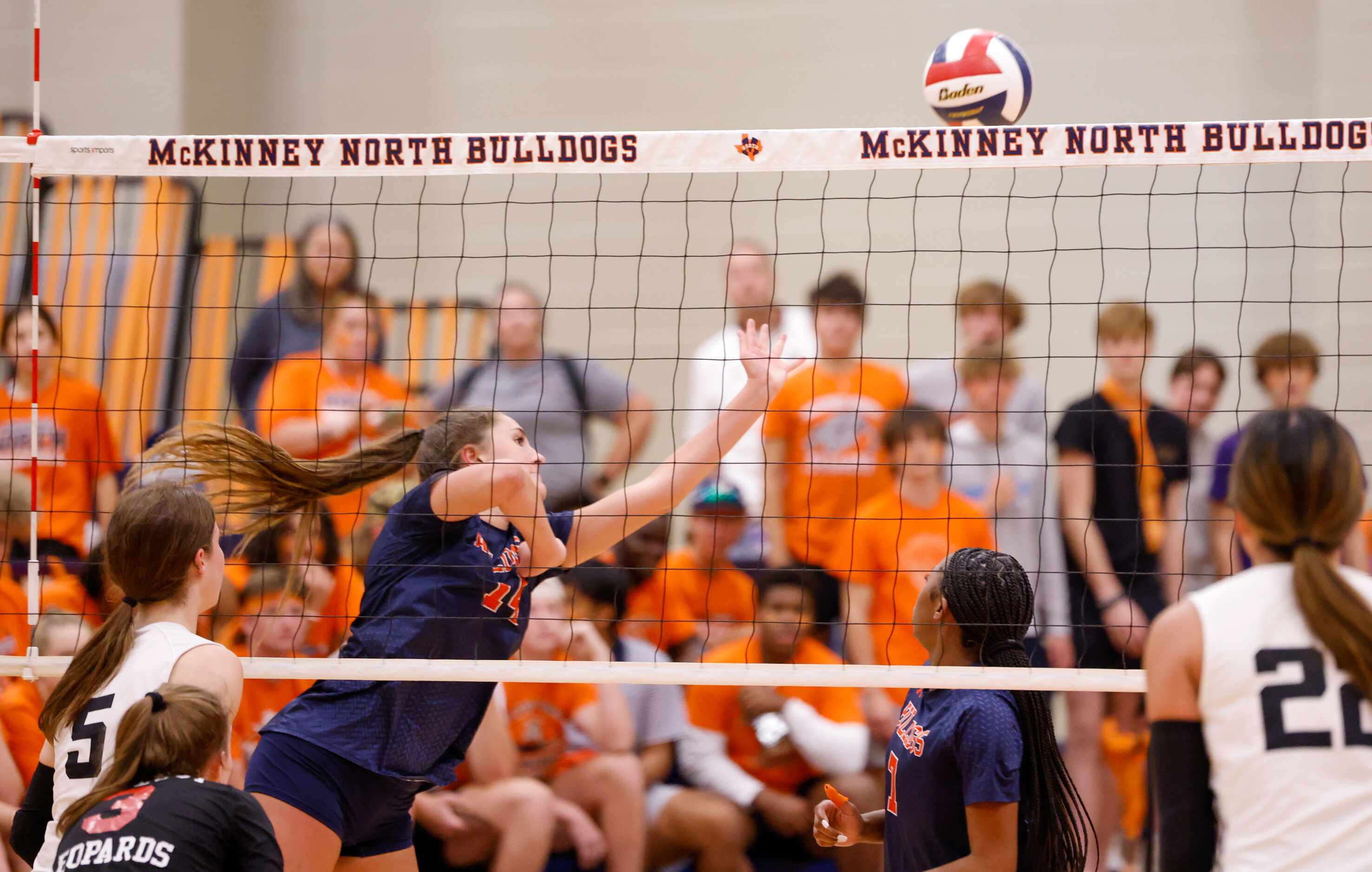 McKinney North Brooke Butler (14) dives for the ball in the fourth set of a match against...