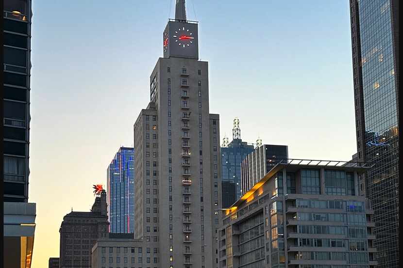 The historic Mercantile National Bank tower with its clock on top and the Element apartment...