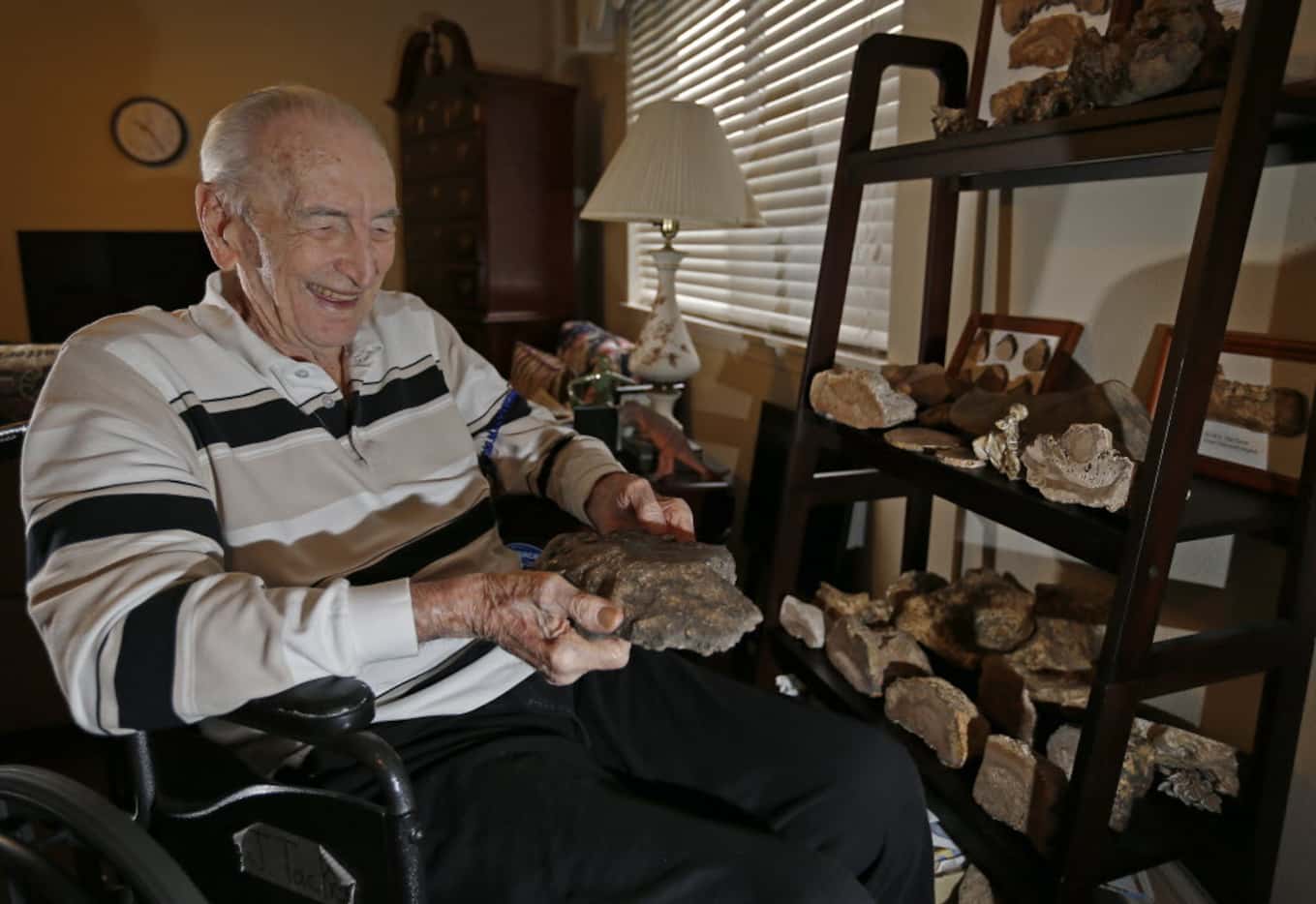 Amateur rock collector John Tackel shares his Dallas apartment with rocks he has collected.  
