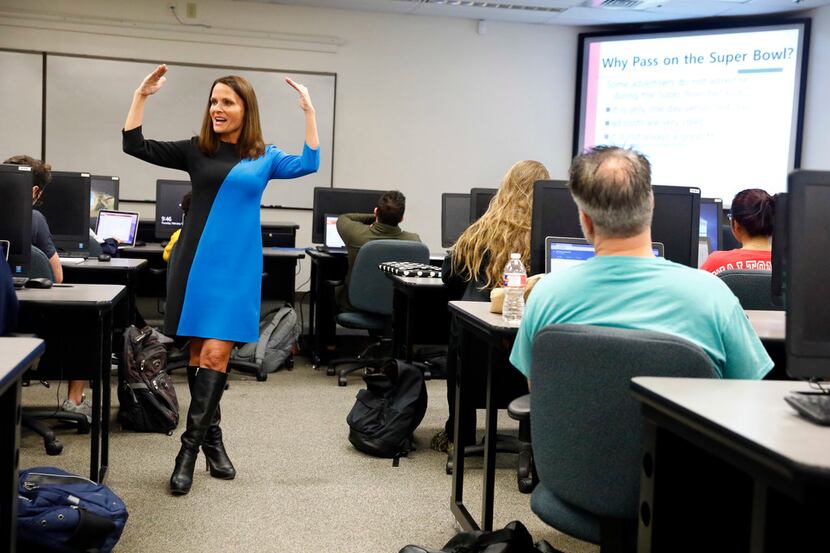 UTA marketing professor Traci Freling teaches students about Super Bowl ads Thursday in her...