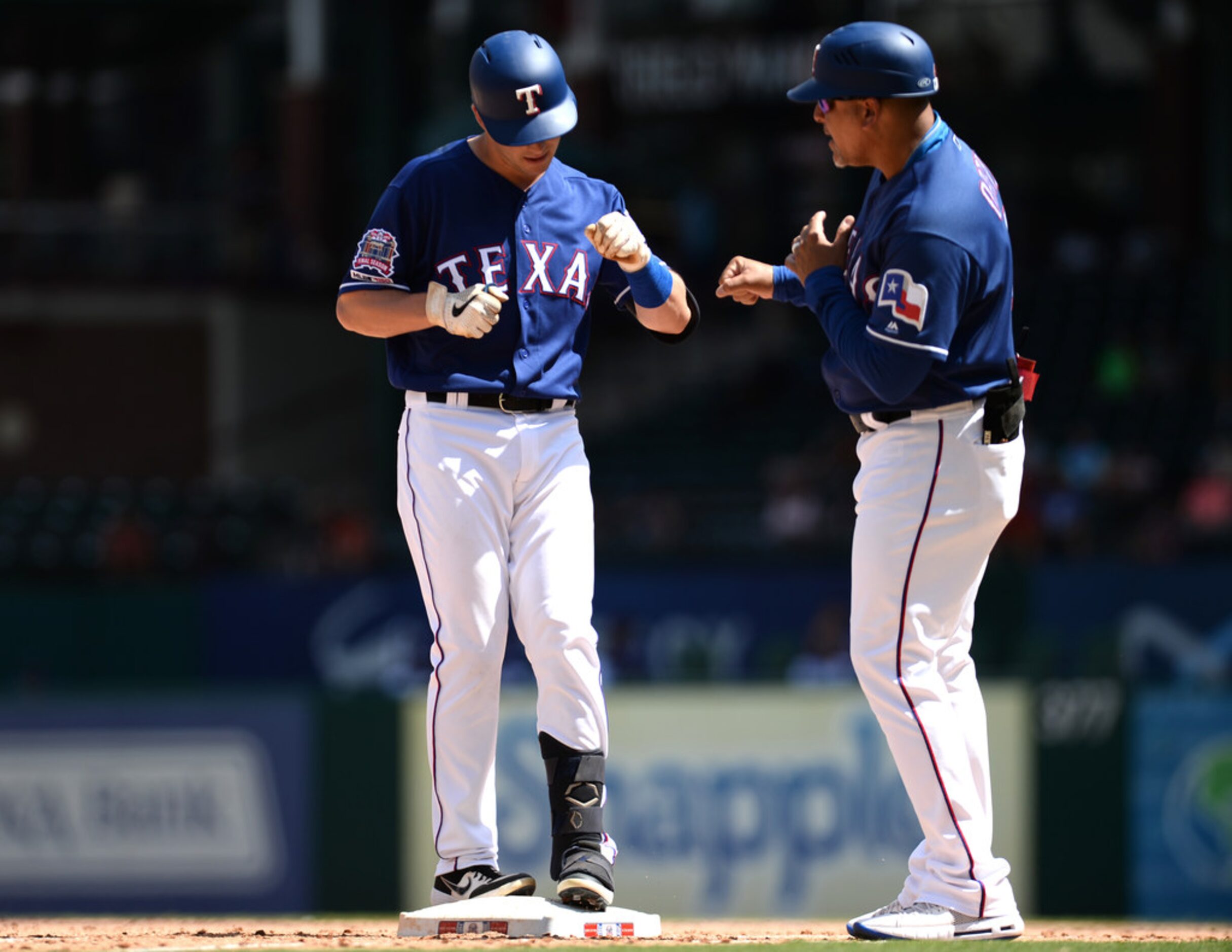 ARLINGTON, TEXAS - AUGUST 20: Nick Solak #15 of the Texas Rangers celebrates his first major...