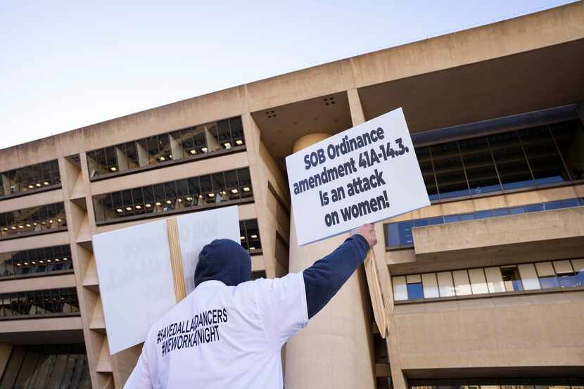 People protesting outside Dallas City Hall in January 2022 of a city ordinance banning strip...