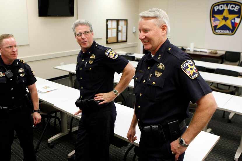 
Mark Moeller (right) meets with Rockwall Police Officer Bryan Pate (from left),  Training...