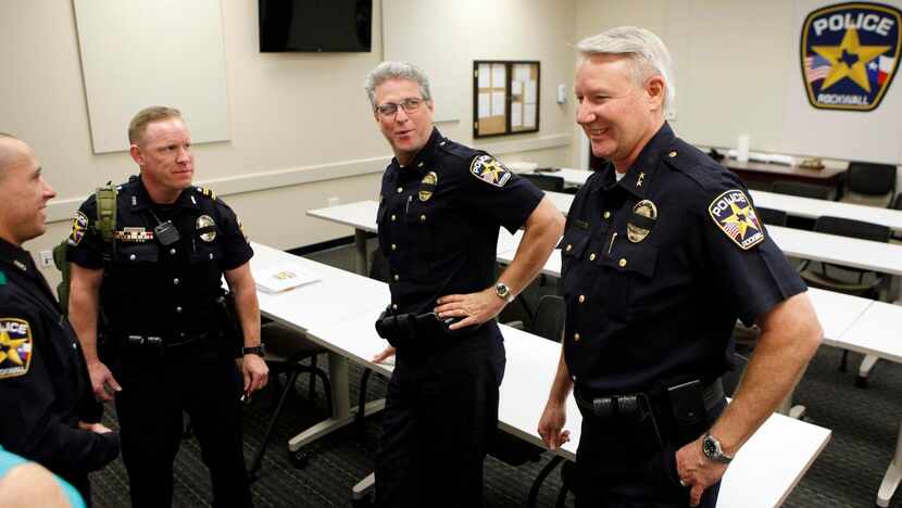 
Mark Moeller (right) meets with Rockwall Police Officer Bryan Pate (from left),  Training...