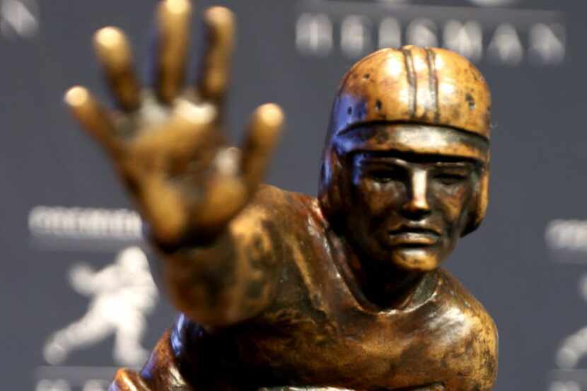 The Heisman Trophy is displayed prior to the announcement of the winner, Saturday, Dec. 13,...