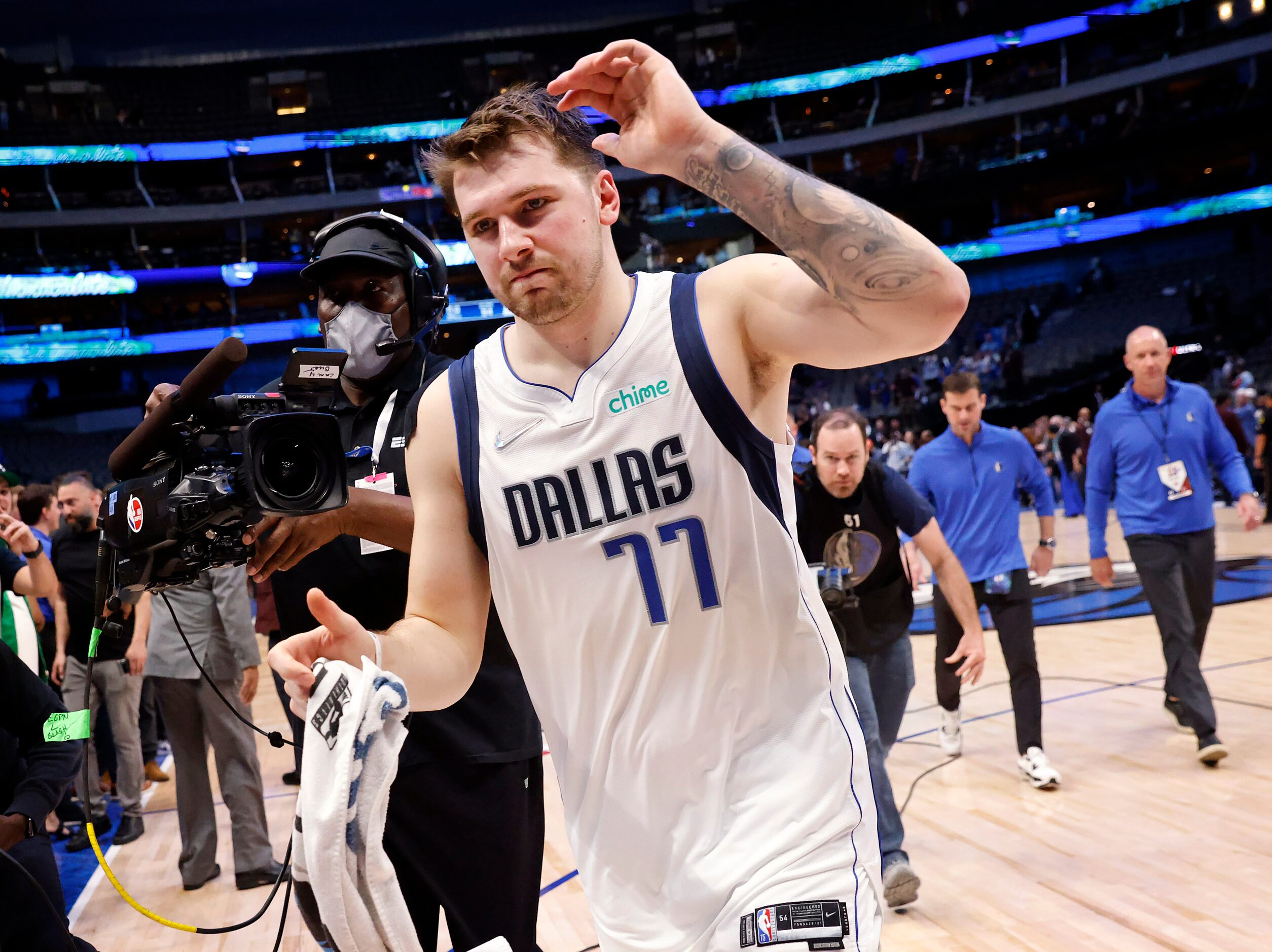 Dallas Mavericks guard Luka Doncic (77) clewlbrates as he runs off the court after defeating...