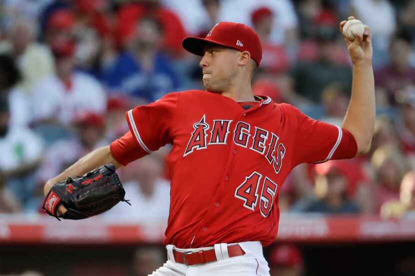 Los Angeles Angels starting pitcher Tyler Skaggs throws against the Toronto Blue Jays during...