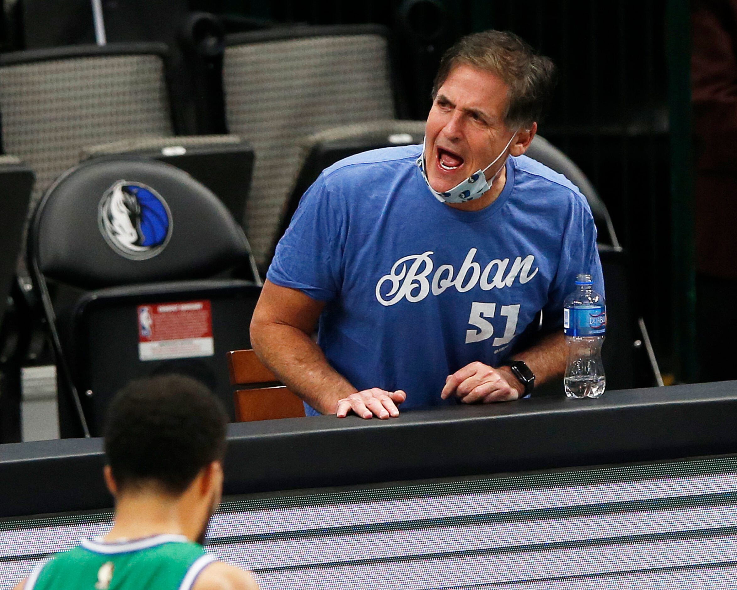 Dallas Mavericks owner Mark Cuban disagrees with a call during the fourth quarter of play in...