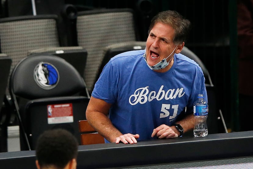 Dallas Mavericks owner Mark Cuban disagrees with a call during the fourth quarter of play in...