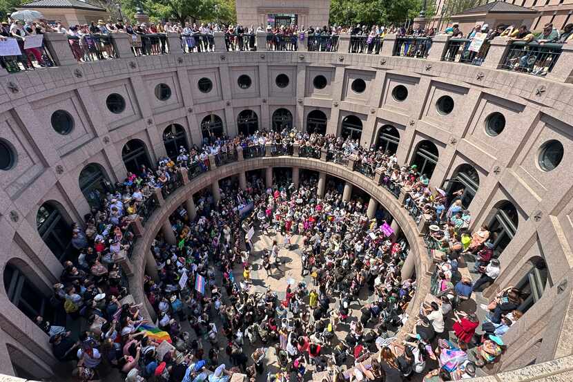 LGBTQ rights activists rally at the Texas Capitol in Austin, Texas, on March 27, 2023.