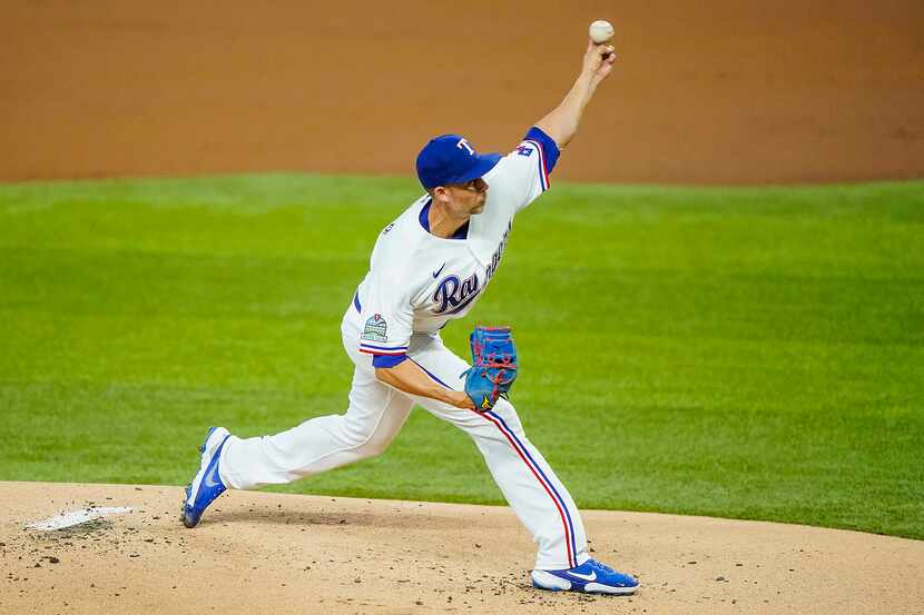 Texas Rangers pitcher Mike Minor pitches during the first inning against the Colorado...