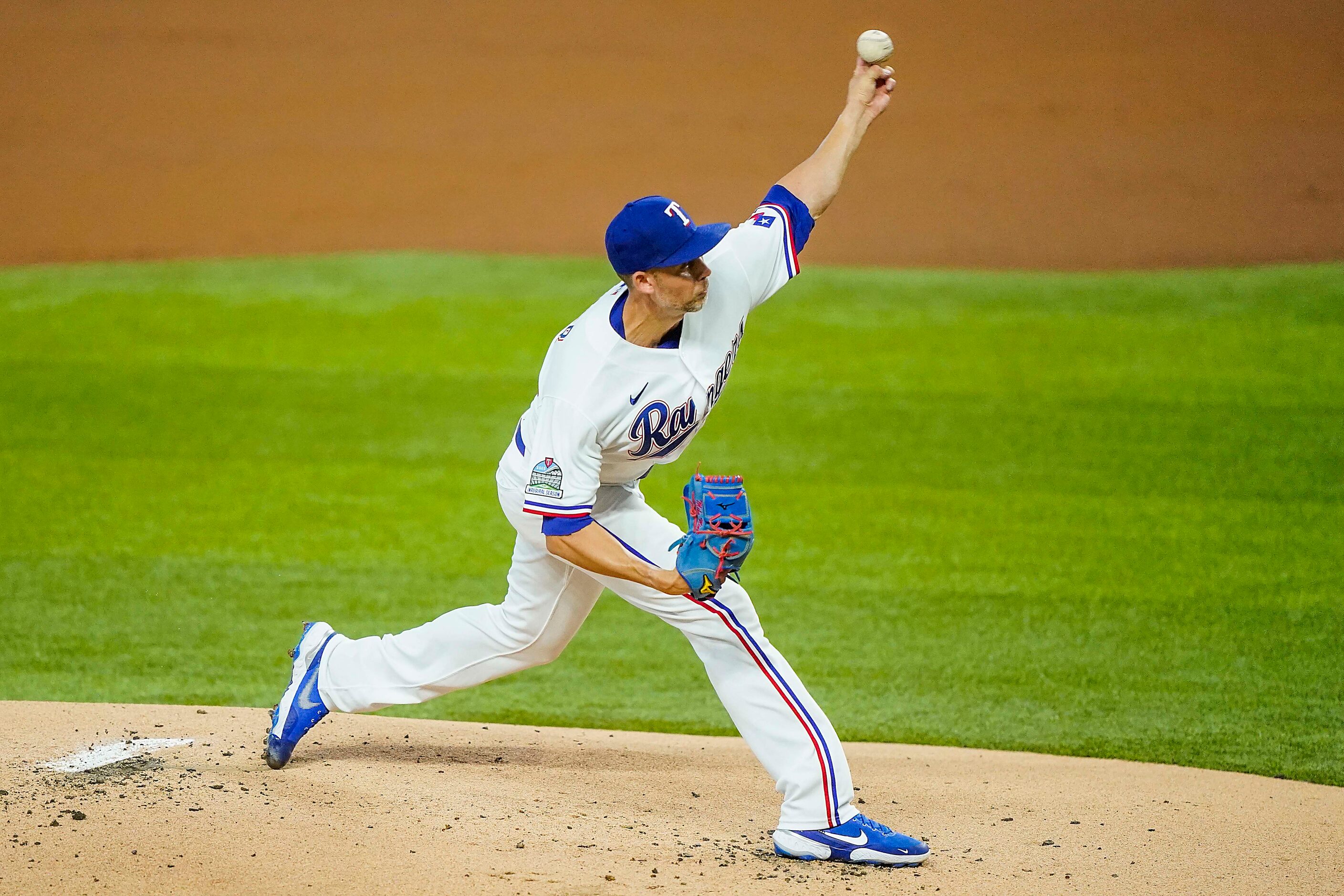 Texas Rangers pitcher Mike Minor pitches during the first inning against the Colorado...