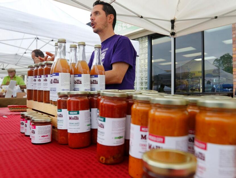 
Gil Zafra sells Molli sauces at the White Rock Farmers Market in Dallas on May 9, 2015....