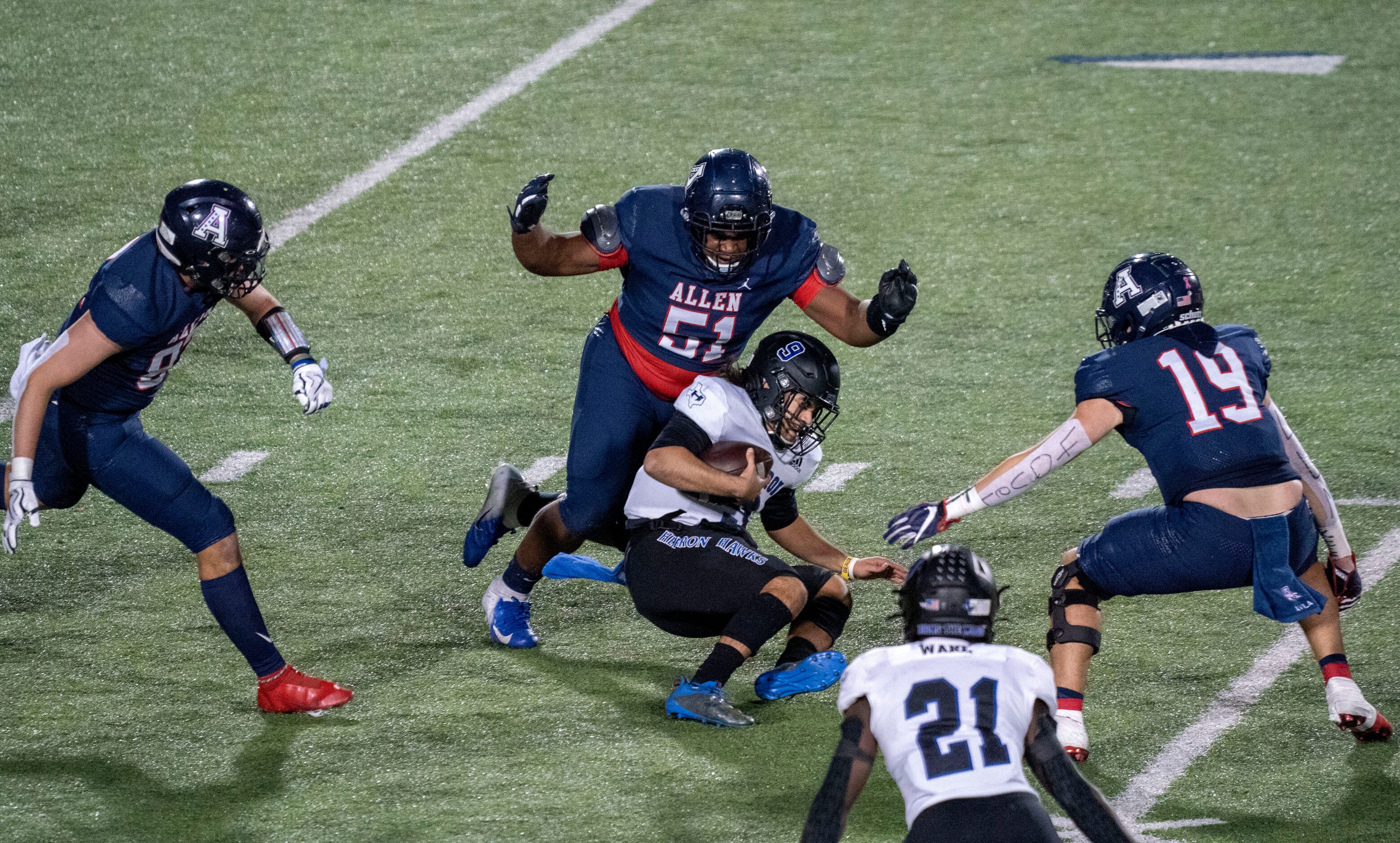 Allen senior defensive lineman Kaleb Nettles (51), senior defensive end Noah Nance (83) and...