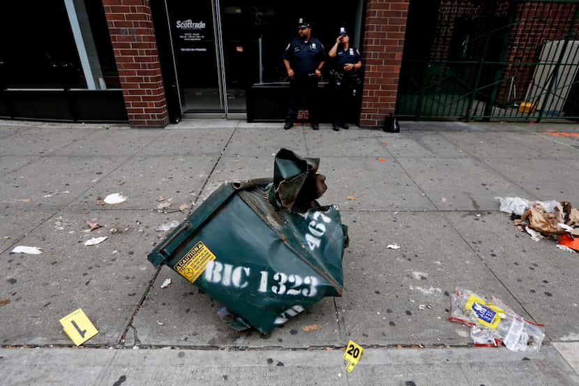 The mangled dumpster at the site of last night's explosion in the Chelsea neighborhood of...