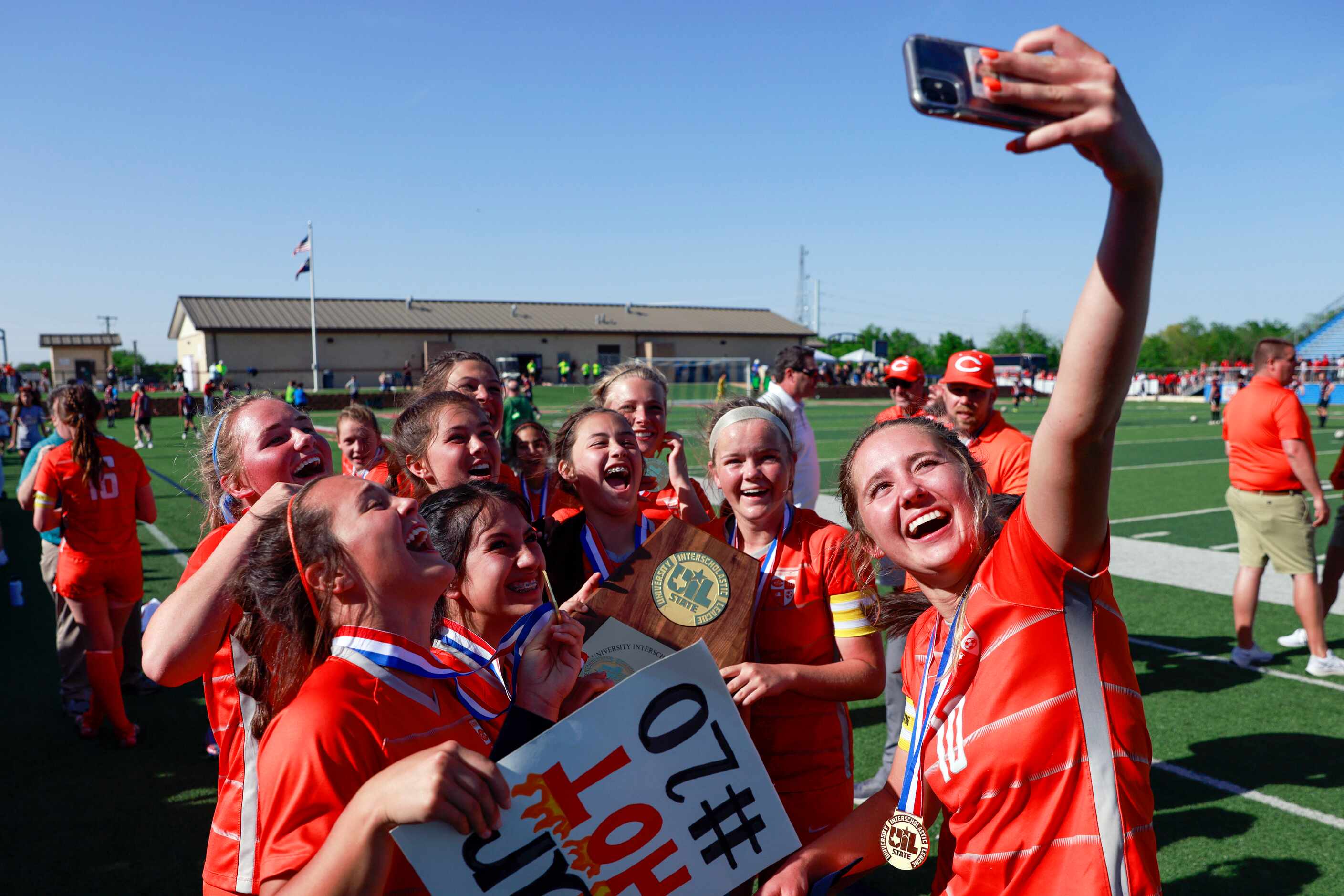 Celina midfielder Mia Norman (10) takes a selfie with her teammates after winning the Class...