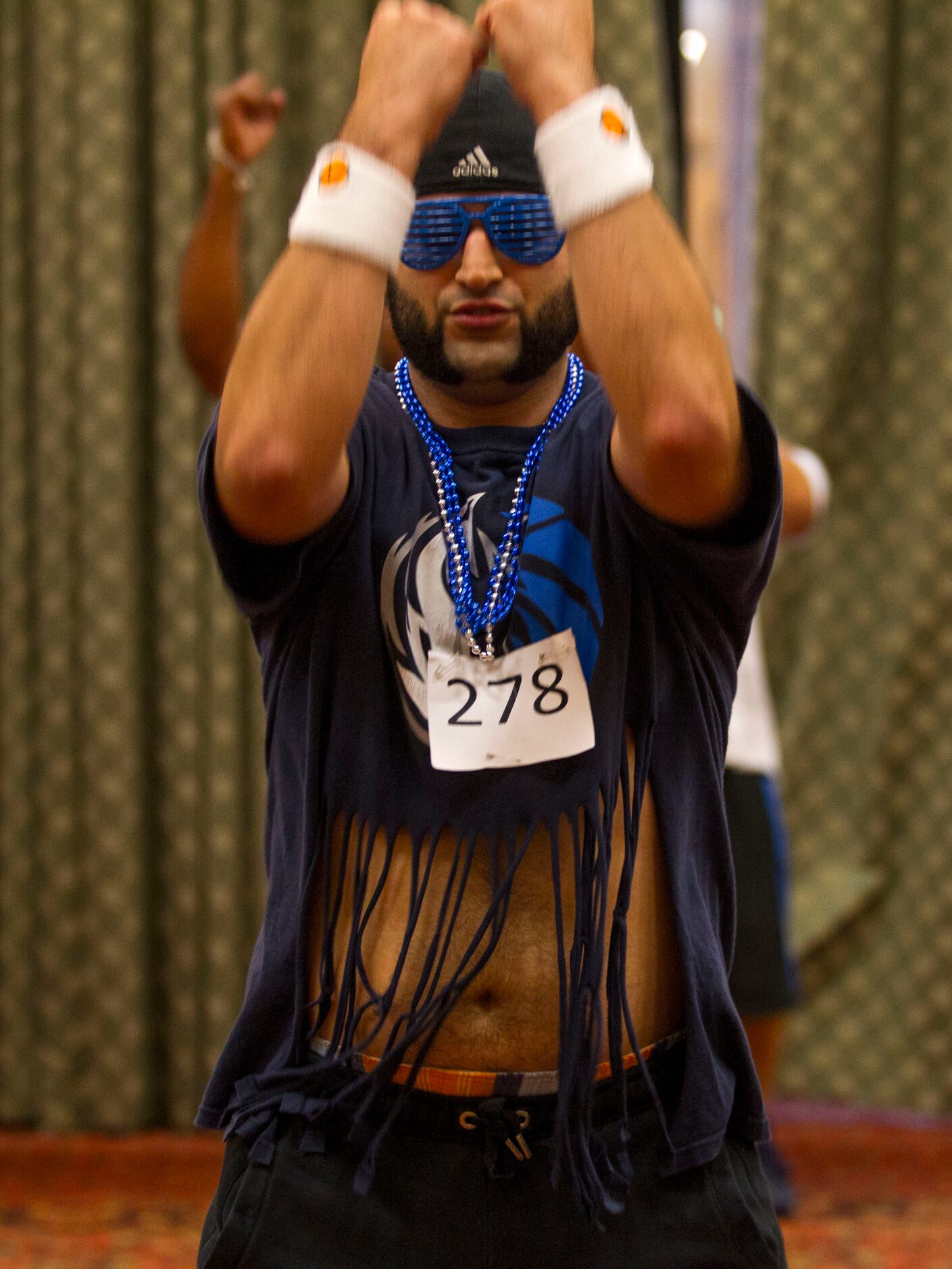 Cavin Ehia, of Dallas, practices dance moves during The Mavs ManiAACs tryouts, which were...