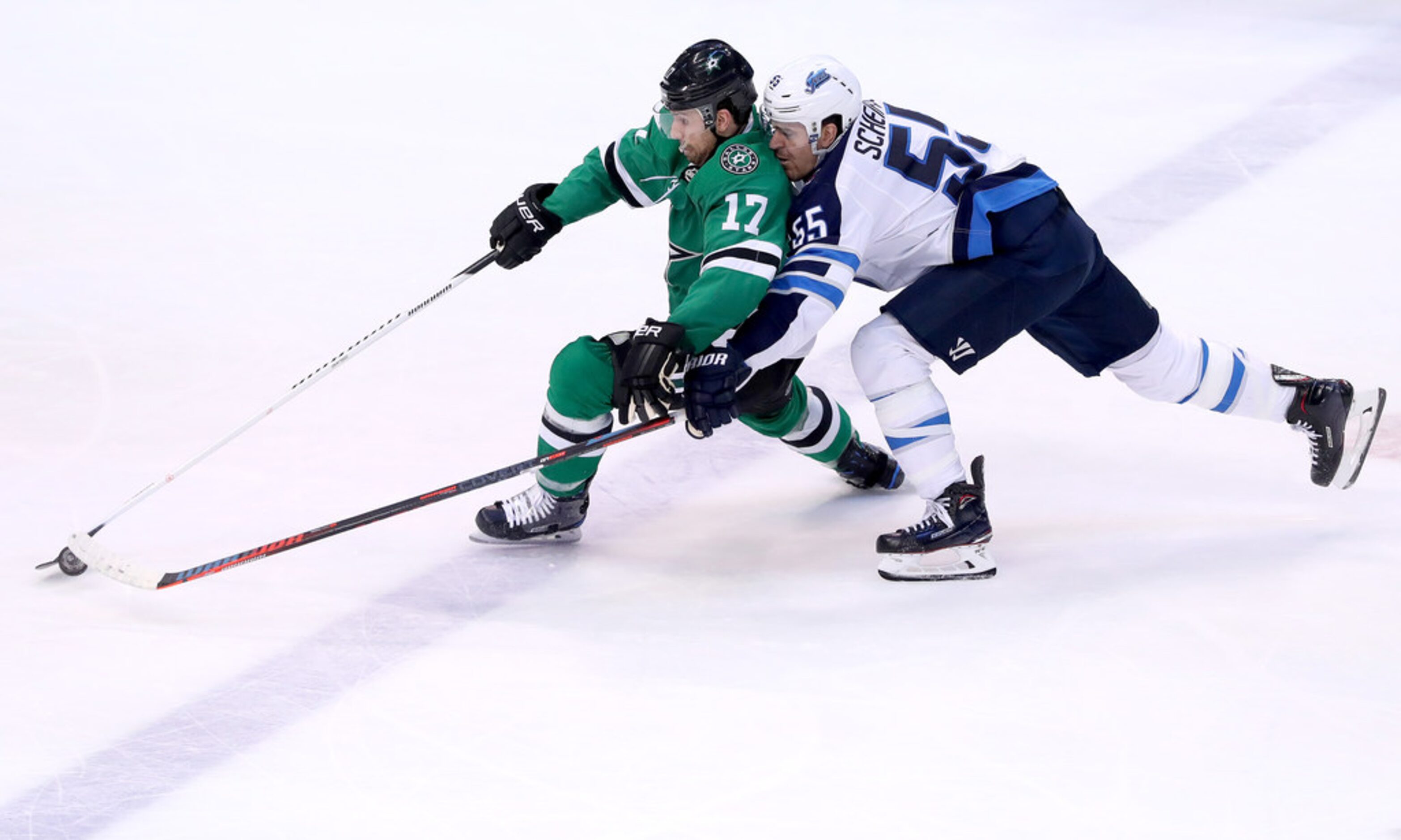 DALLAS, TEXAS - JANUARY 19: Andrew Cogliano #17 of the Dallas Stars controls the puck...