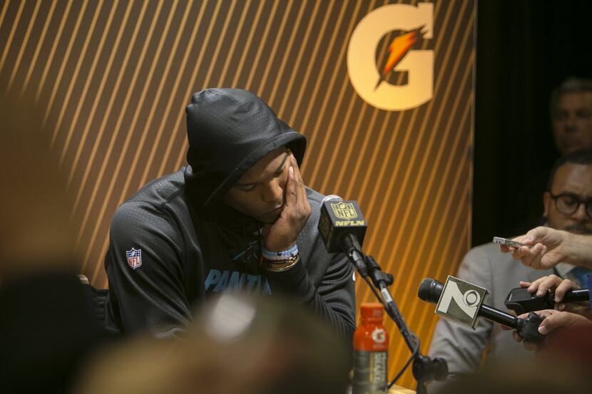 Carolina Panthers quarterback Cam Newton speaks to the media at a postgame news conference...