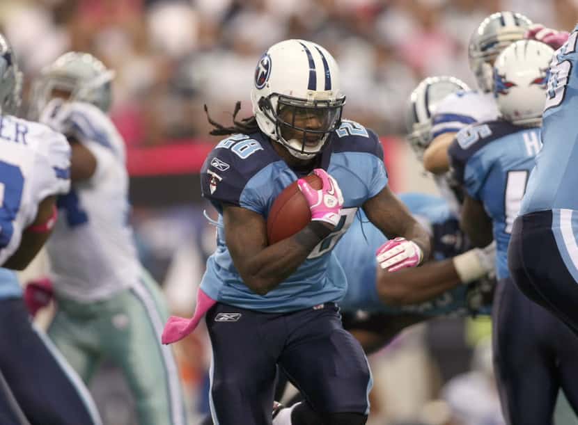 Tennessee Titans' runningback Chris Johnson finds a hole in the Dallas Cowboys' defense...