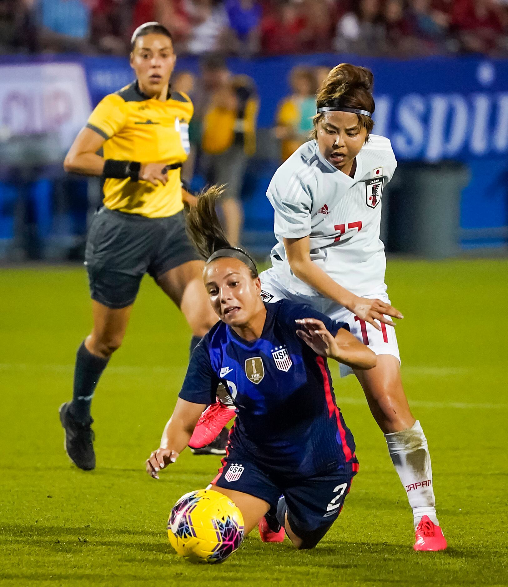 USA forward Mallory Pugh (2) is tripped by Japan midfielder Narumi Miura (17) during the...