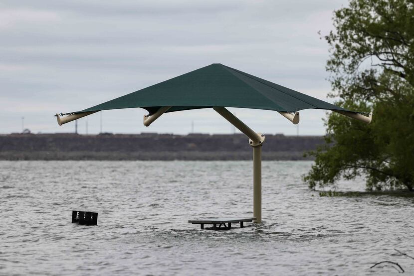 The water level at Grapevine Lake came up to the level of grills along the lake earlier this...