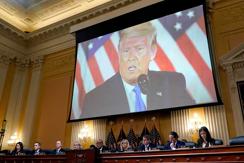 A video of former President Donald Trump is shown on a screen, as the House select committee...