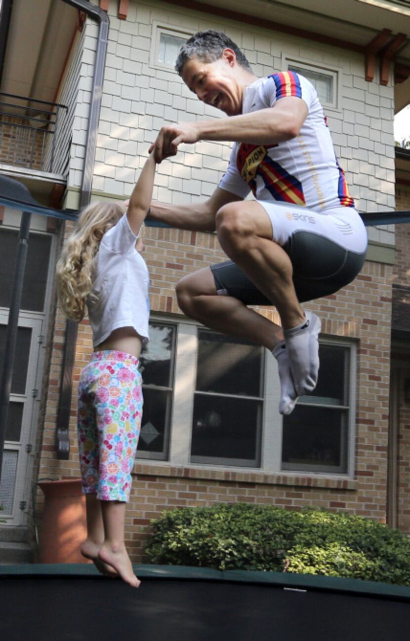 Adams and daughter Trinity jump on the family's trampoline. “If we jump 15 to 20 minutes...
