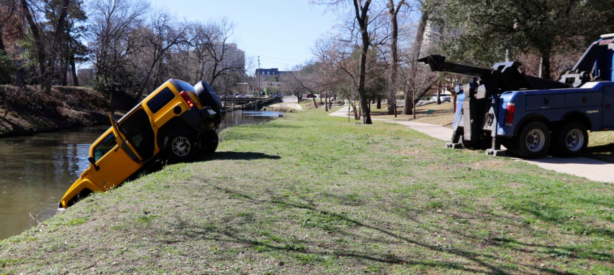 A yellow H3 Hummer went into the water at 3506 Turtle Creek Boulevard.