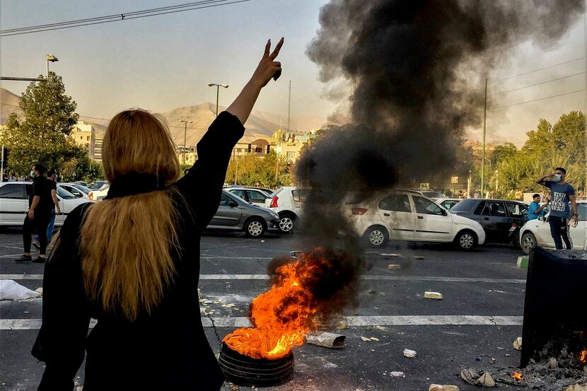 Iranians protests the death of 22-year-old Mahsa Amini after she was detained by the...