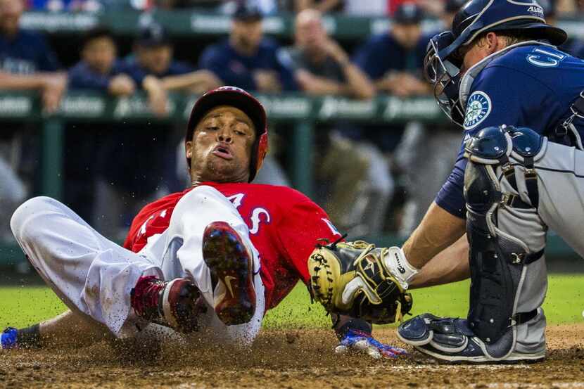 Texas Rangers third baseman Adrian Beltre (29) is tagged out at home by Seattle Mariners...
