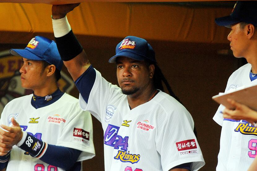 Manny Ramirez (center) looks on during his debut after joining EDA Rhinos in March.