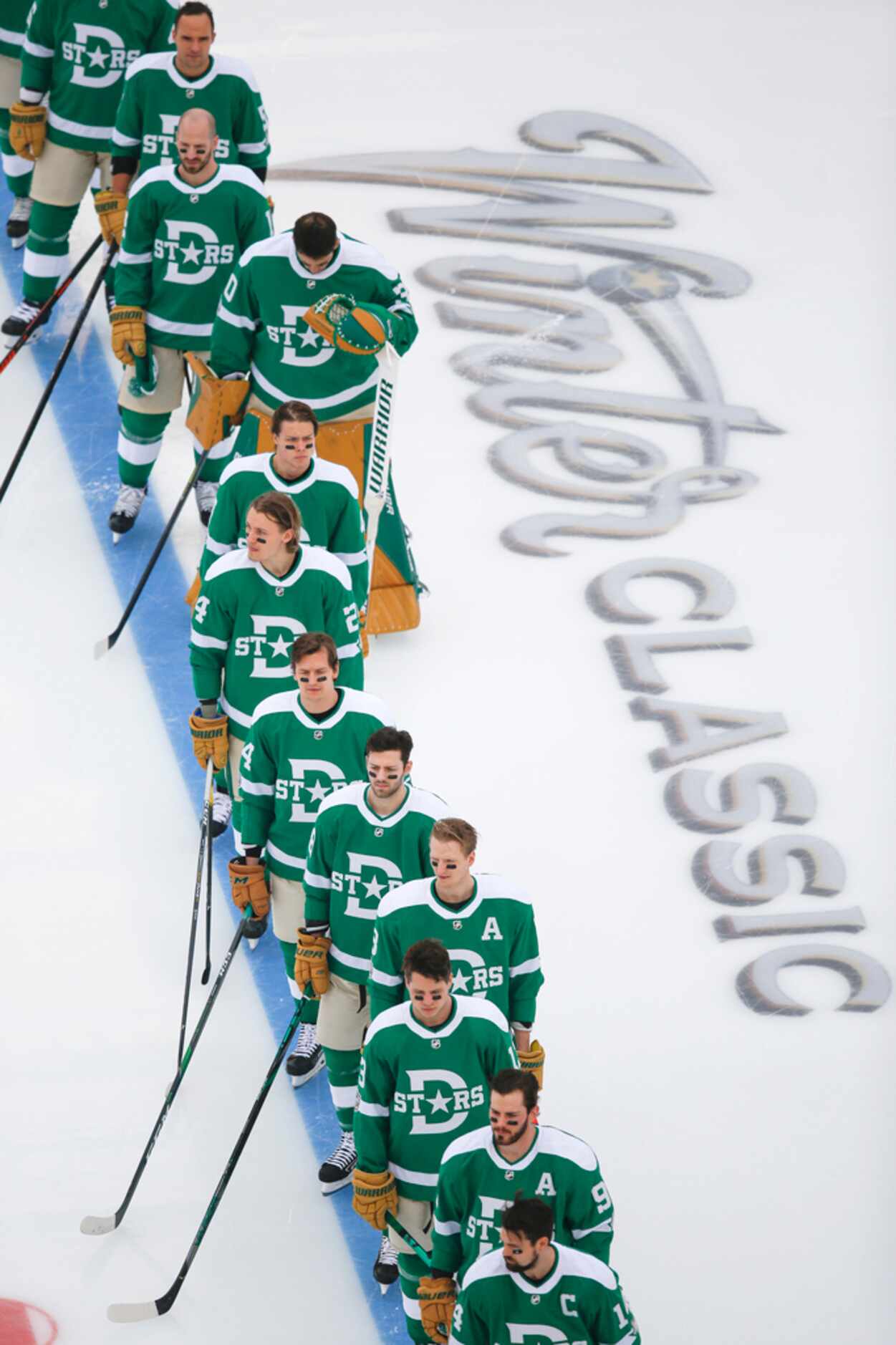 The Dallas Stars line up for the national anthem prior to a NHL Winter Classic matchup...