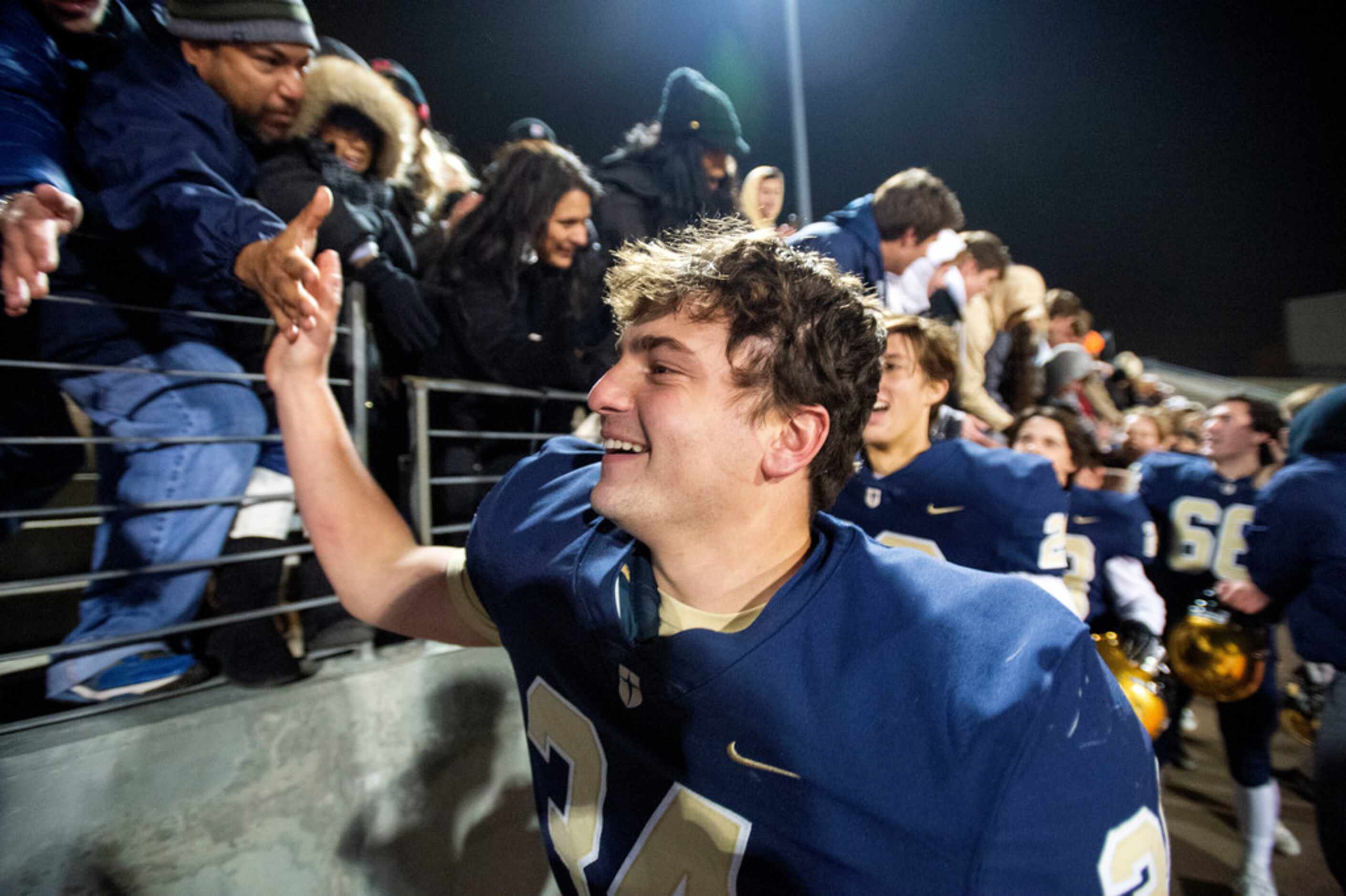 Jesuit sophomore defensive lineman Nico Boyd (34) celebrates with fans after his team's...