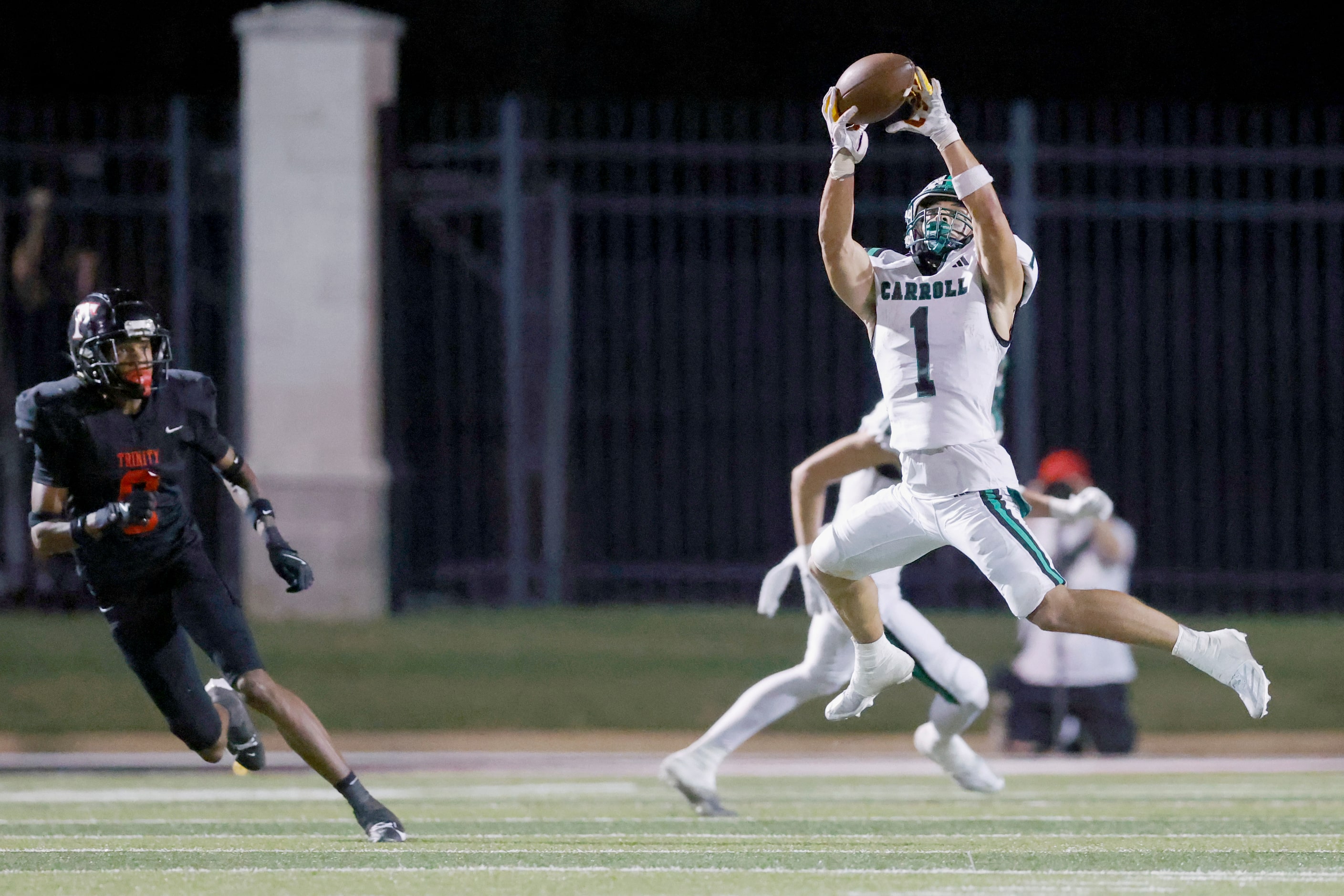 Southlake Carroll running back Riley Wormley (1) makes a leaping catch during the second...