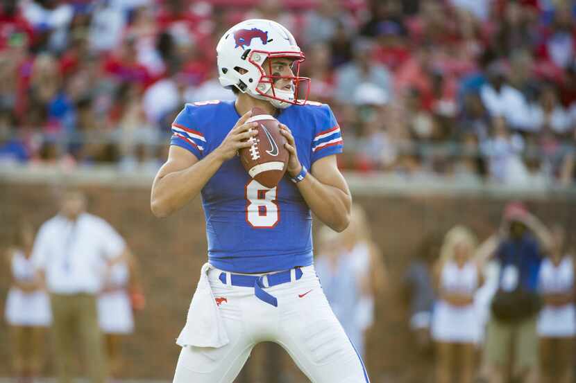 DALLAS, TX - SEPTEMBER 9:  Ben Hicks #8 of the SMU Mustangs drops back to pass against the...
