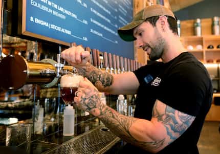 Alex Ortiz pours a beer at Armor Brewing Company in Allen.
